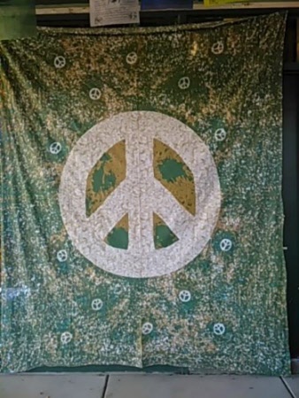 large peace sign wall hanging