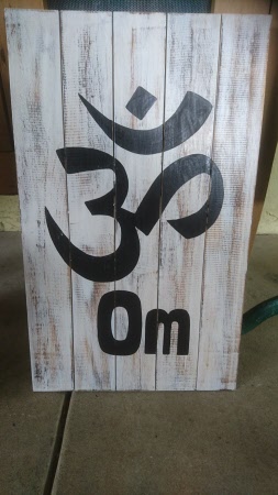 Om sign painted on wood