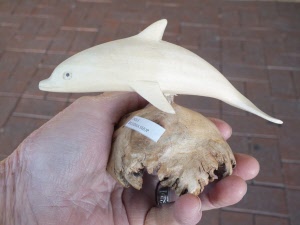 Single dolphin carved from wood