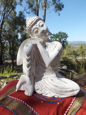 Resting Buddha hand carved